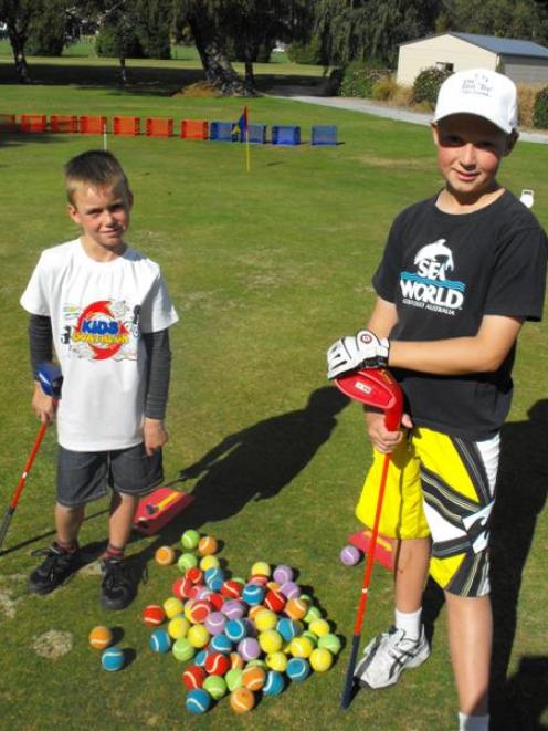 Golfing brothers Liam (8) and Callum (11) Judkins, of Queenstown, prepare for a big week in which...