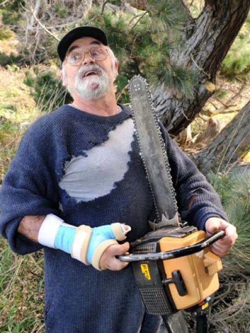 Gordon Weare, of Warrington, re-enacts his brush with death when his chainsaw fell on top of him...