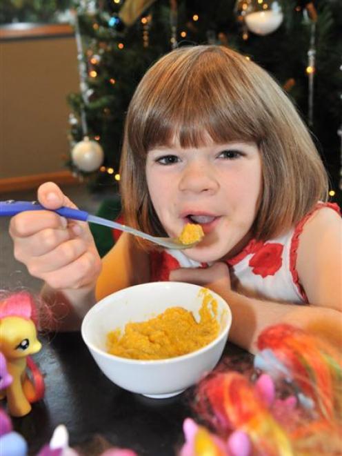 Grace Hughes shows off her eating skills. Photo by Linda Robertson.