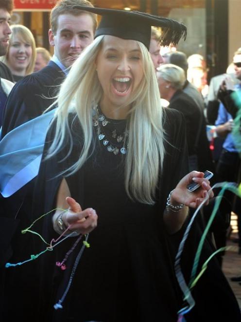 Graduand Meg Wilson, of Dunedin, recognises a friend as she takes part in Saturday's graduation...
