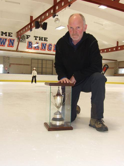 Graeme Glass displays the Erewhon Cup, which dates  to the first organised ice hockey tournament...