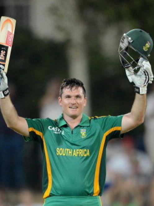 Graeme Smith of South Africa celebrates reaching 100 against New Zealand in the third one-day...
