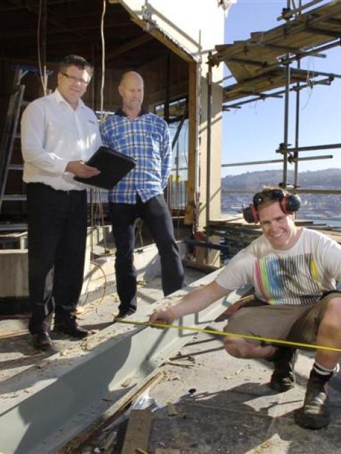 Graeme Sneddon Builders apprentice Ben Jenkins works on a house renovation in Dunedin under the...