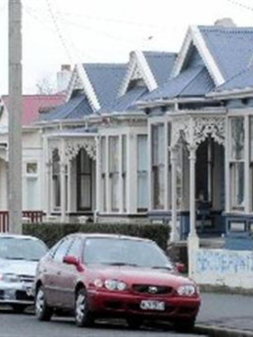 Graffiti adorns a fence in Castle St, the heart of the North Dunedin student flatting area. Photo...