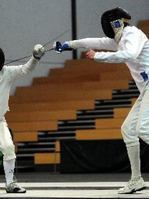 Graham Payne (left) and Brett Davis battle it out in the epee final of the New Zealand fencing...