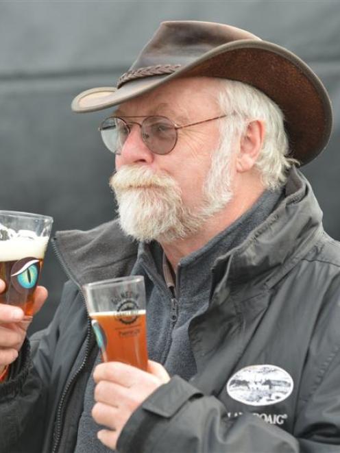 Graham Scott, of Dunedin, tastes beers at the Dunedin Craft Beer Expo at Dunedin Railway Station...