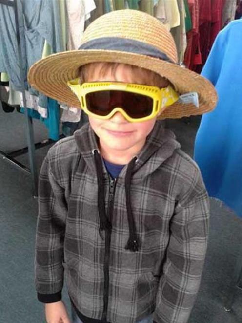 Grandson Rowan  looks the part in op shop shades and hat.