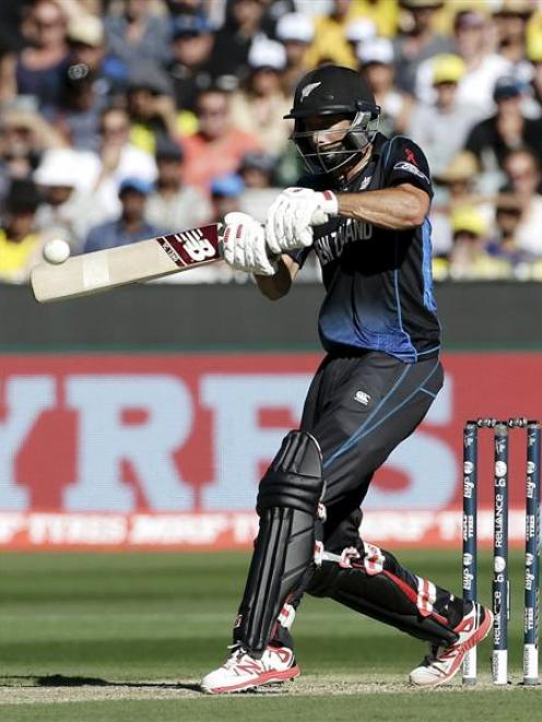 Grant Elliott hits a six during the Cricket World Cup final match against Australia at the MCG....