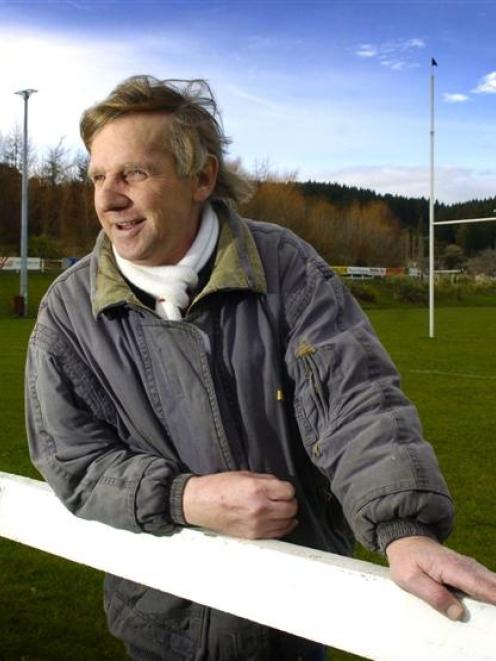 Grant McDowell at the spot where his house used to be, now the try-line of a rugby field on a...