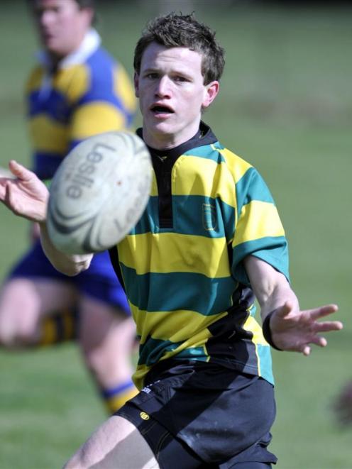 Green Island halfback Devin Stapley passes the ball during the match against Strath Taieri...