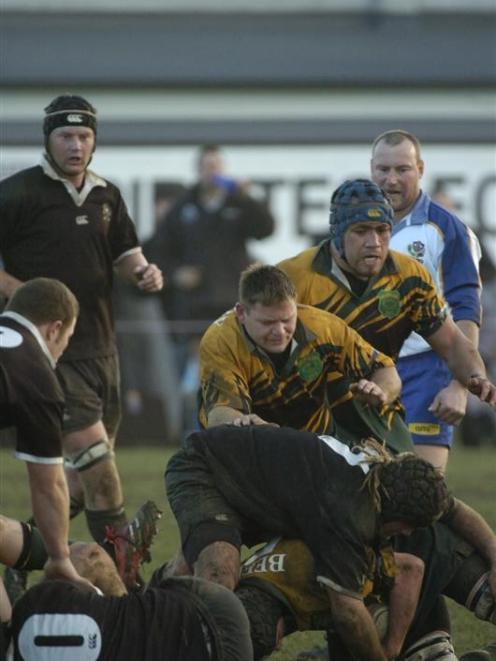 Green Island prop Jason Short (centre) in action against Pirates in Dunedin club rugby. Photo by...