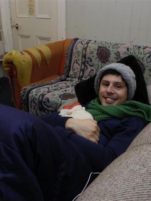Green Party housing spokesman Gareth Hughes rugs up for his stay in a Dunedin student flat. Photo...