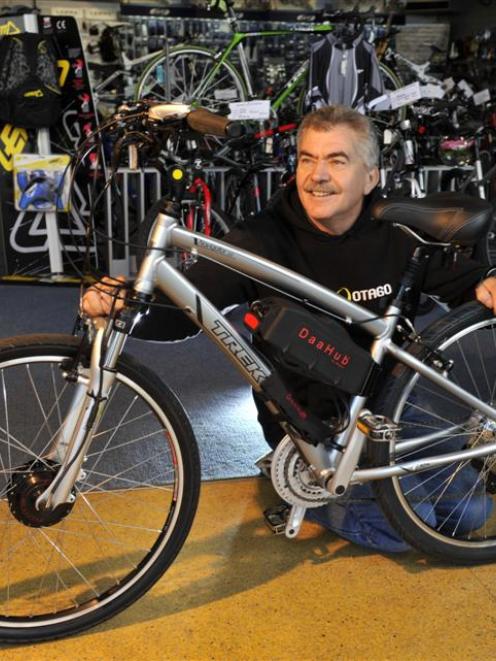 Greg Leov, of Bike Otago, and a cycle fitted with a battery-powered  kit to convert it to an...