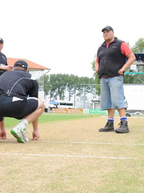 Groundsman Tom Tamati (right) is bounced a few questions by Black Caps opener Jamie How ...