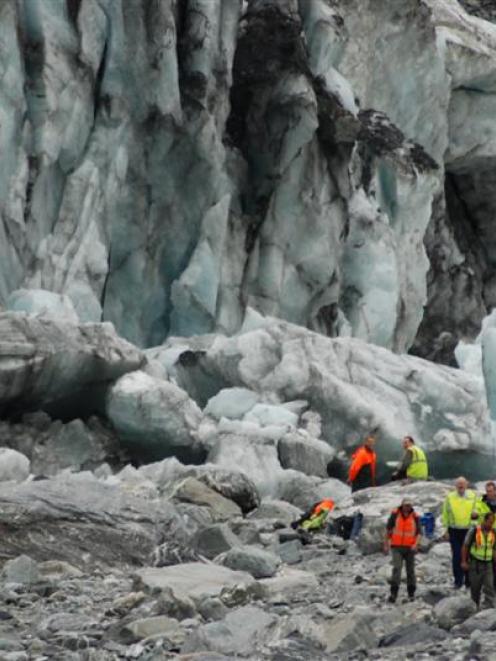 Guides and police at Fox Glacier with family members of the dead tourists. Photo from 'Greymouth...