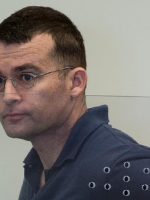 Guy Silcock stands in the dock during his sentencing on fraud charges at the North Shore District...