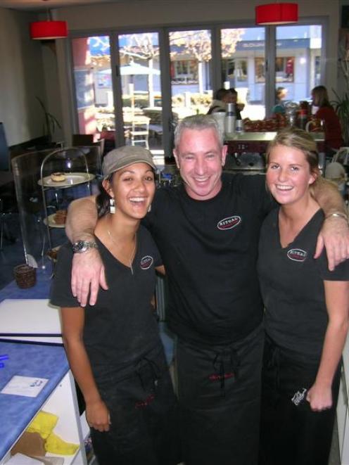 Ritual Café owner Chris Hadfield (centre) with employee Fiona Thomas (left) and fellow singer...
