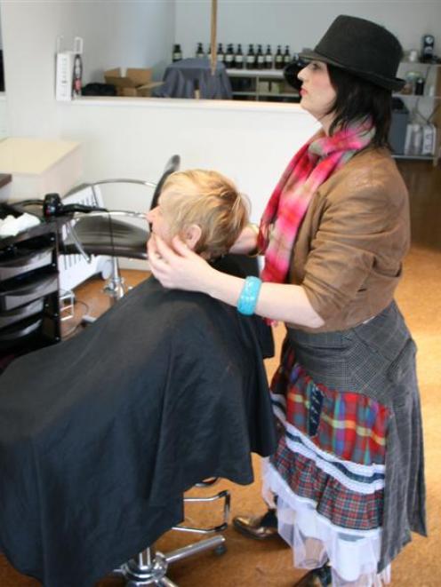 Hairdresser Holly Pemberton (right), of Roxburgh, gets into the Scottish spirit with client (left...
