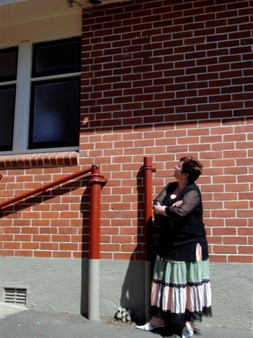 Halfway Bush School principal Stephanie Madden surveys the spot where a copper downpipe was...