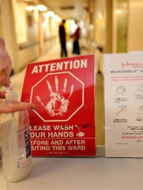 A nurse cleans her hands before entering ward 8B at Dunedin Hospital yesterday. Photo by Stephen...