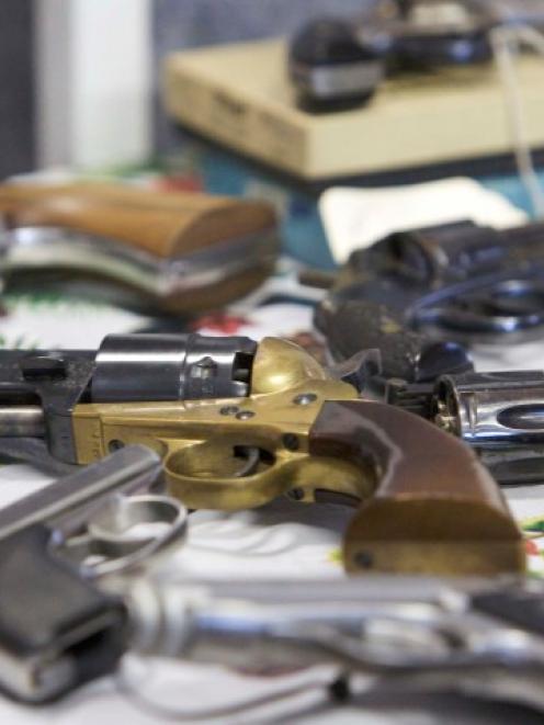 Handguns turned in are seen during a gun buyback event in Bridgeport, Connecticut, in the wake of...