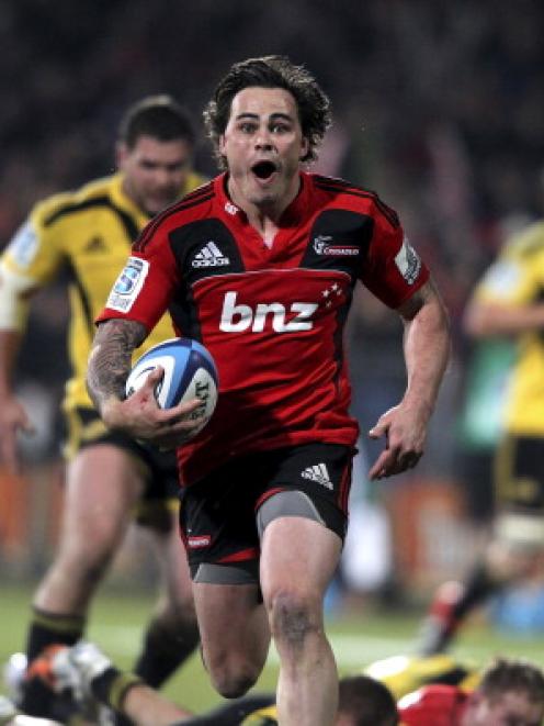 Happier times . . . Zac Guildford runs away to score a try for the Crusaders against the...