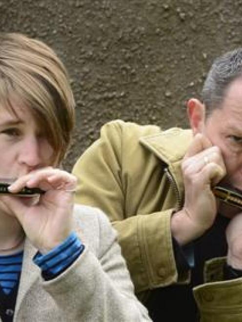 Harmonica players (from left) Terry Ebeling, Elise Allen, Clive Copeman and Leo LaDell blow up a...