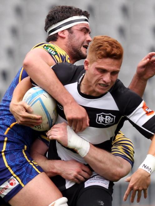 Hawkes Bay's Ihaia West tries to bust through the Otago defence. Photo Getty Images
