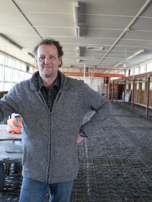 Head of the technology faculty John Adamson checks the progress of Dunstan High School's...