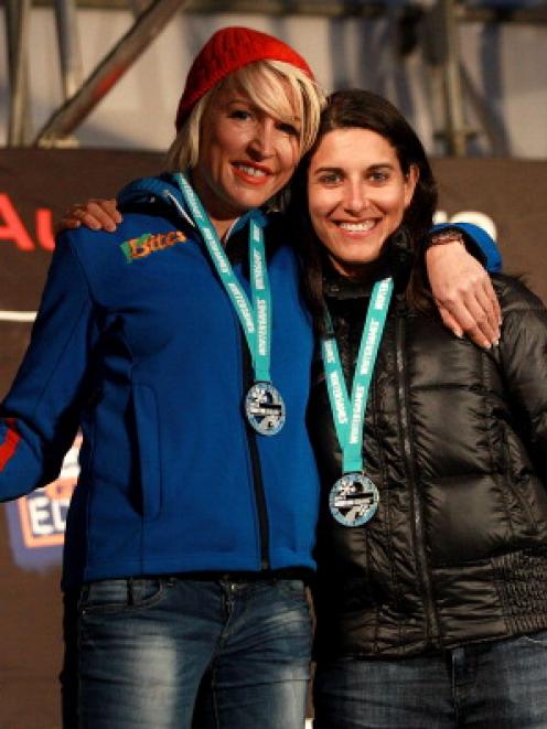 Heather Mills of Great Britain and Melanie Schwartzc of the USA pose on the podium after their...