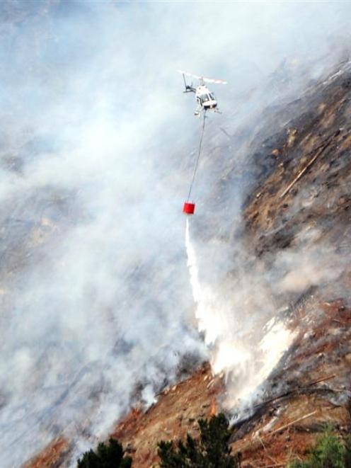 Helicopters fight a forest fire at Mt Allan last December. Photo by Peter McIntosh.