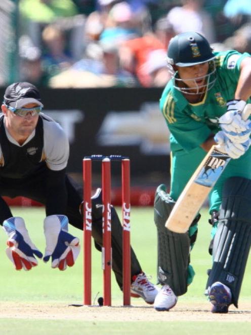 Henry Davids of South Africa and Brendon McCullum of New Zealand in action during the sides'...