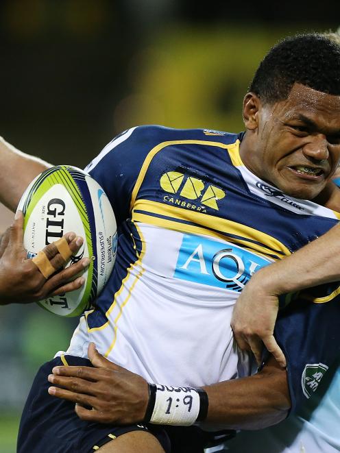 Henry Speight of the Brumbies is tackled during the round eight Super Rugby match between the...
