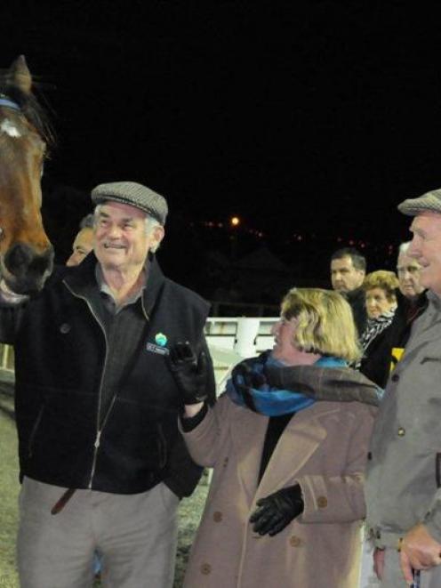 Here Comes Pat with owners Denis Stumbles (left) and Jim Hunter after her win at Forbury Park...