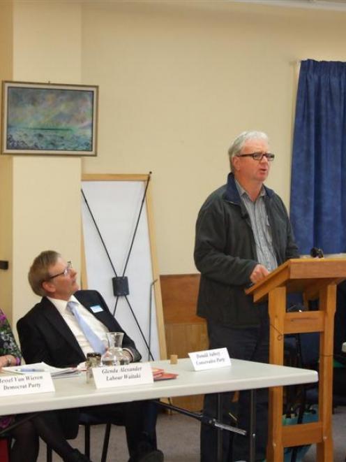 Hessel van Wieren addresses the Waitaki candidates' meeting watched by his fellow candidates ...