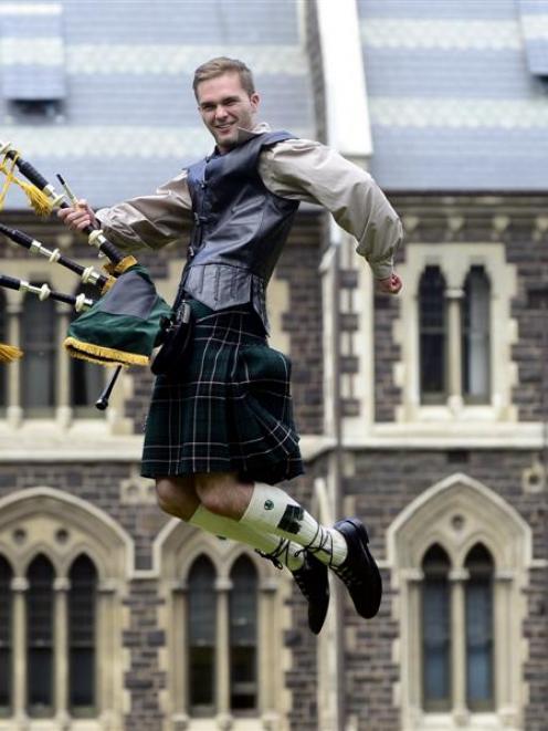 Highland piper Andrew McLean (20) celebrates his graduation from the University of Otago today....
