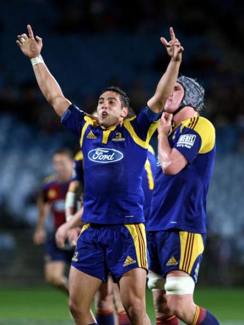 Highlander Daniel Bowden celebrates the win against the Crusaders in the Super 14 rugby match at...