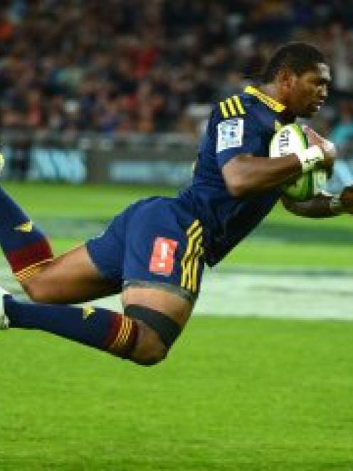 Highlander Waisake Naholo scores a try during the Super 15 Rugby match between Highlanders and...