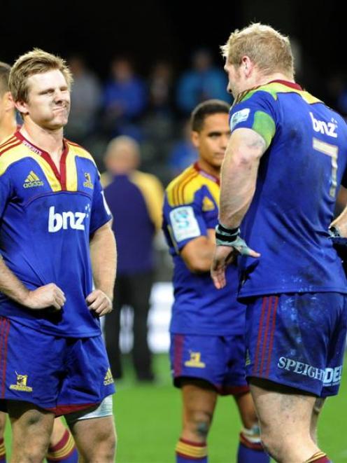 Highlanders first five Chris Noakes (left) and flanker Adam Thomson react after the 21-6 loss to...