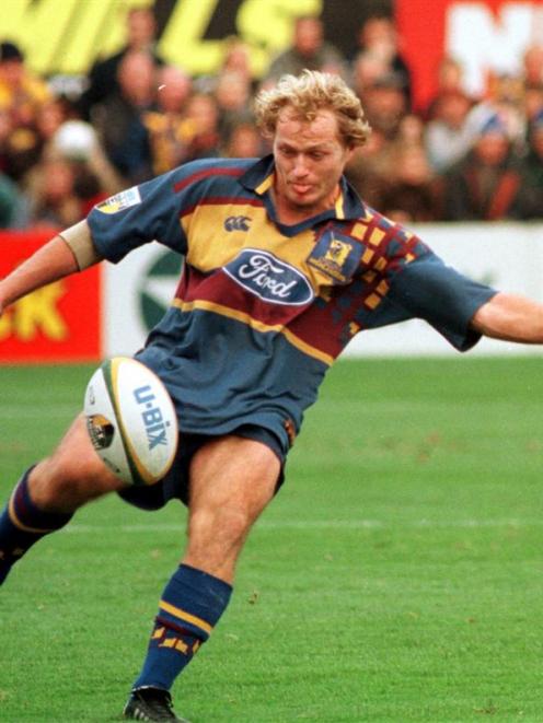 Highlanders first five Tony Brown kicks during the 1999 Super 12 final at Carisbrook. Photo from ...