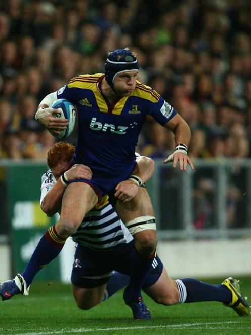 Highlanders flanker James Haskell is tackled. (Photo by Teaukura Moetaua/Getty Images)