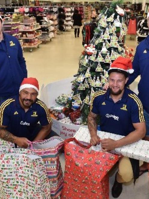 Highlanders (from left) Marty Banks, Ash Dixon, Elliot Dixon and Joe Wheeler with the bundles of...