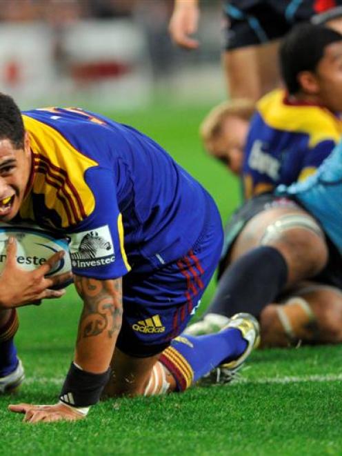 Highlanders halfback Aaron Smith scores a try during his team's round three Super 15 match...