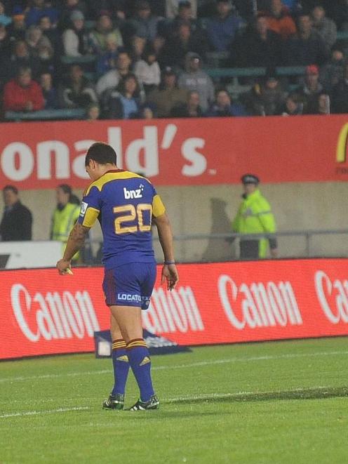 Highlanders halfback Aaron Smith walks off after being given his marching orders by referee Chris...