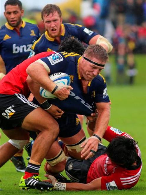Highlanders lock Brad Thorn takes the ball up during his side's pre-season match against the...