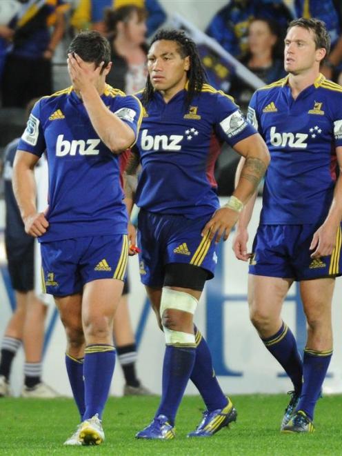Highlanders players (from left) Phil Burleigh, Ma'a Nonu and Ben Smith digest the loss to the...