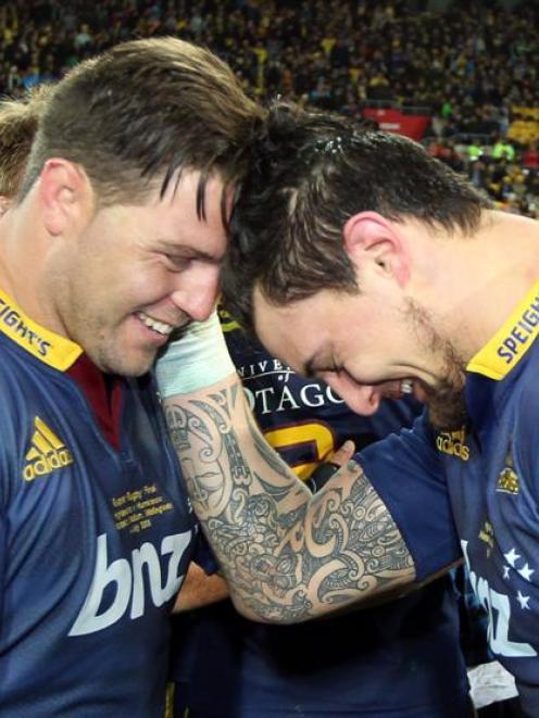 Highlanders players Josh Hohneck (left) and man of the match Elliot Dixon share a moment after...