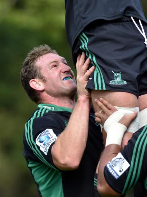 Highlanders prop Chris King lifts a team-mate at training at Logan Park this week. Photo by Peter...