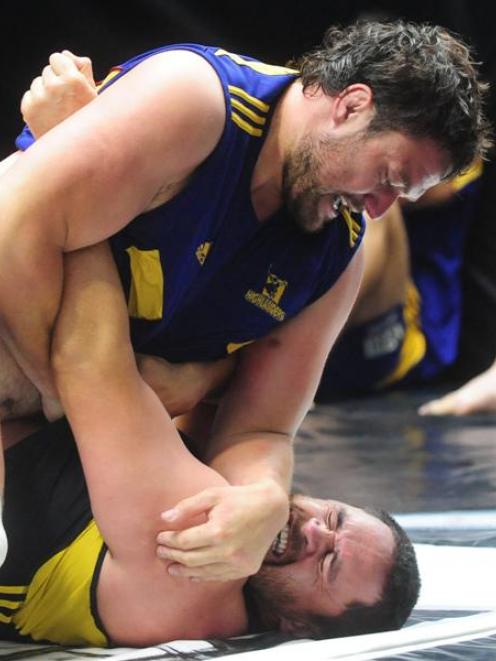 Highlanders props Clint Newland (top) and Bronson Murray grapple for supremacy during an...