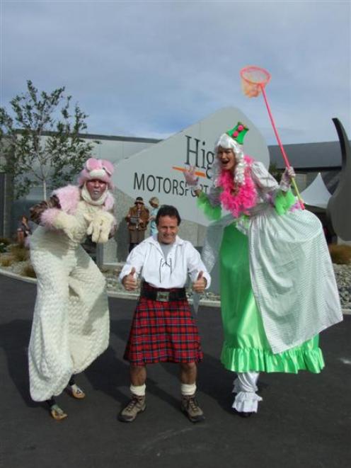 Highlands owner Tony Quinn with Flame Productions  stilt walkers TJ Irvin (left), of Hawea, and ...